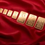 eight pieces of gold on a red cloth to depict gold investment in ghana